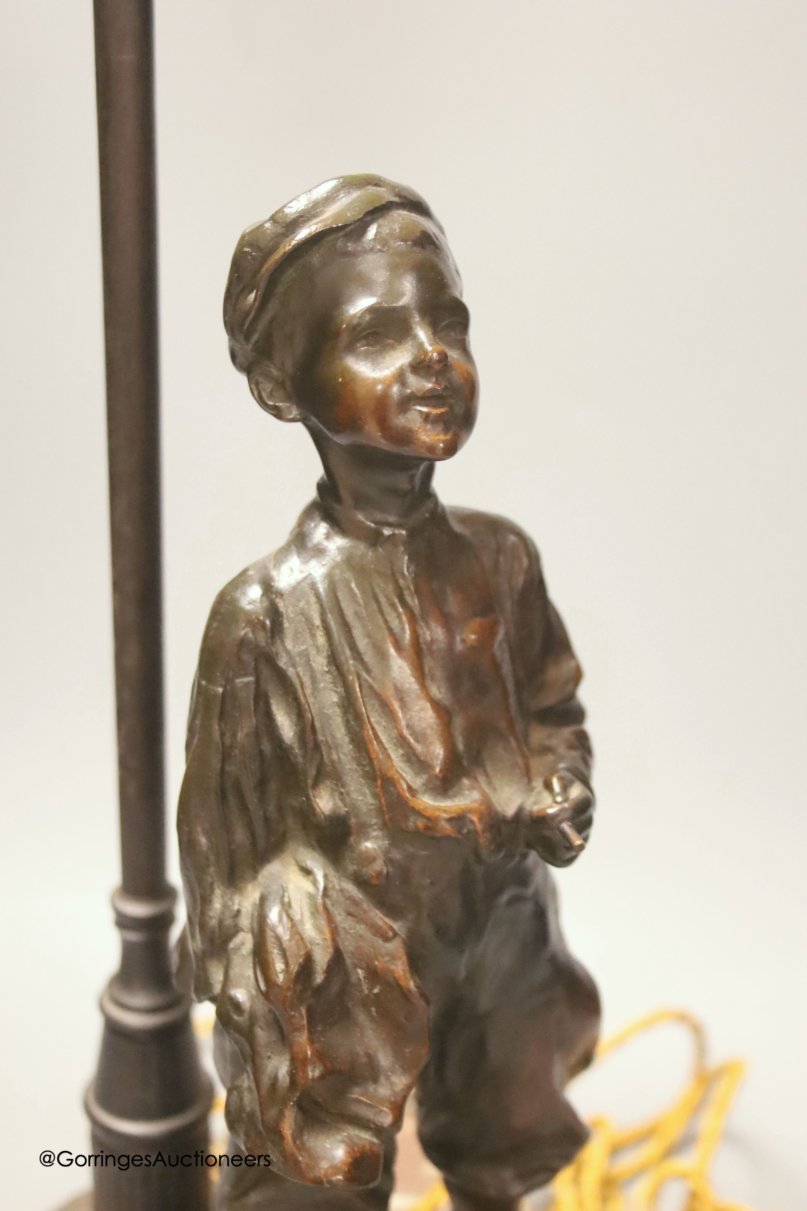 A bronze desk lamp, a boy standing beneath a street lamp, signed, height 62cm